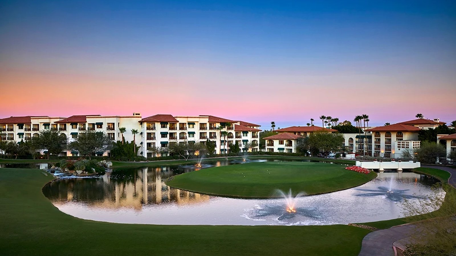 Arizona Grand Resort at sunset, lake and palms