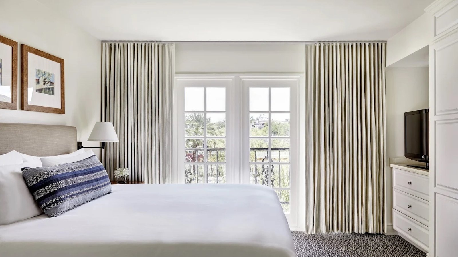 All-suite bedroom with French doors to balcony
